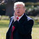 President Donald Trump yells to reporters as he walks to board Marine One on the South Lawn of the White House, Wednesday, Nov. 29, 2017, in Washington. Trump is returning to Missouri on Wednesday as he tries to push the Republican tax plan across the finish line.